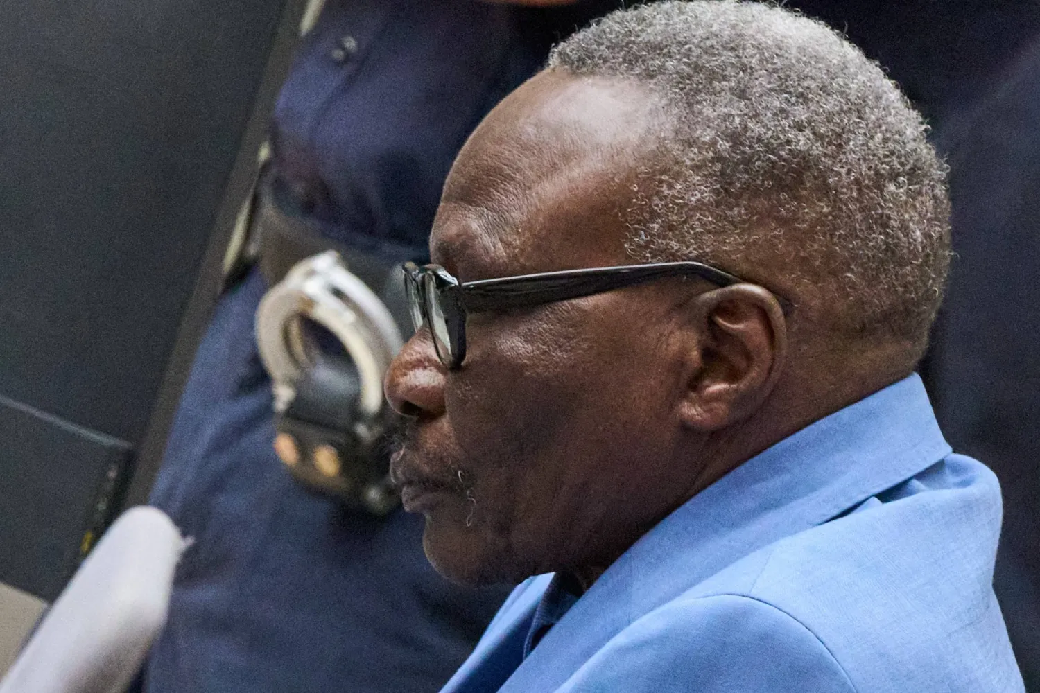 Ali Muhammad Ali Abd al-Rahman, a leader of the Sudanese Janjaweed militia, at the International Criminal Court, ICC, in The Hague, Netherlands, Tuesday, Dec. 9, 2025. (AP Photo/Peter Dejong, Pool)
