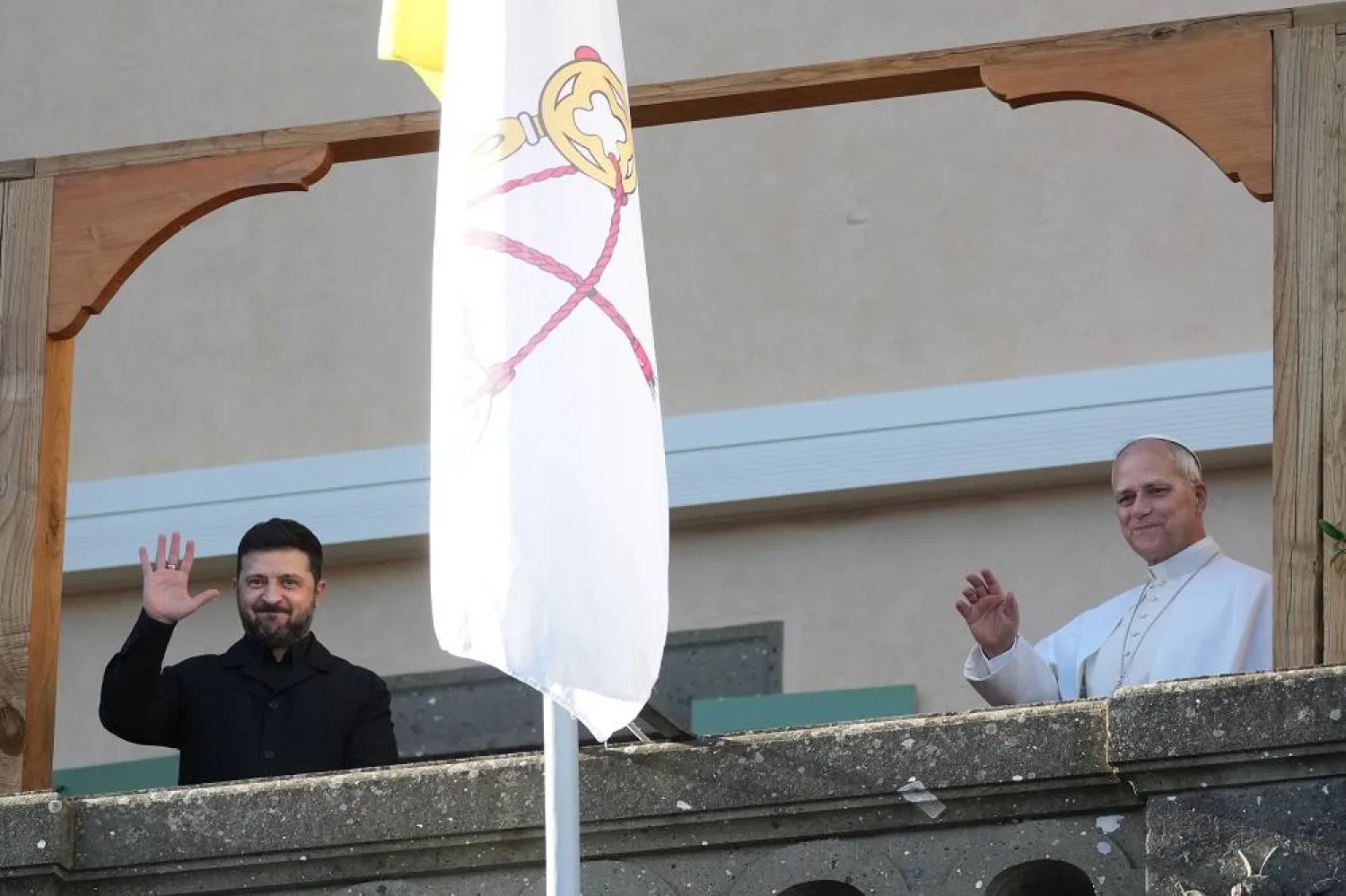 Ukraine President Volodymyr Zelenskyy and Pope Leo XIV wave to journalists during their meeting in Castel Gandolfo, Italy, Tuesday, Dec. 9, 2025. (AP)