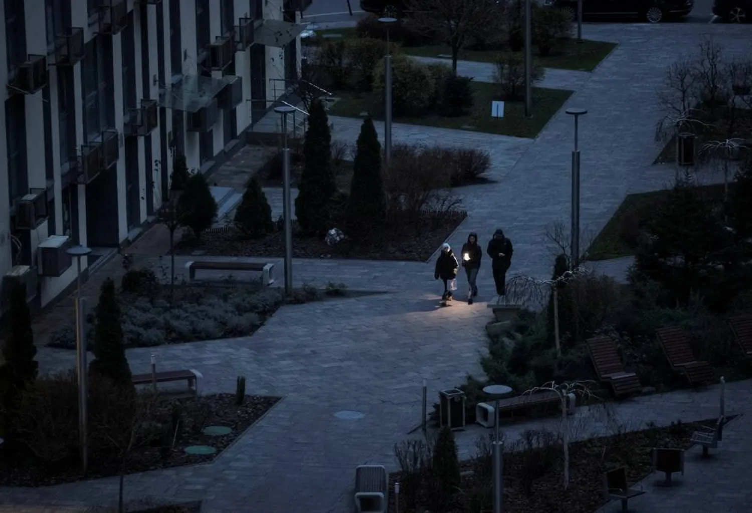  People use a flashlight as they walk during a power blackout after critical civil infrastructure was hit by recent a Russian missile and drone attacks, amid Russia's attack on Ukraine, in Kyiv, Ukraine December 8, 2025. (Reuters)