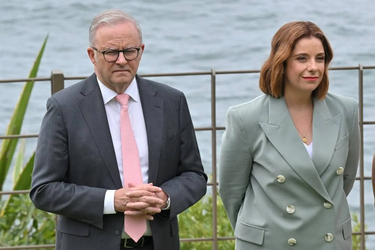 Prime Minister Anthony Albanese and Minister for Communications Anika Wells stand during an event to mark the beginning of the social media ban for children under 16 years of age, at Kirribilli House in Sydney, Australia, December 10, 2025. (AAP/Mick Tsikas/via Reuters) 
