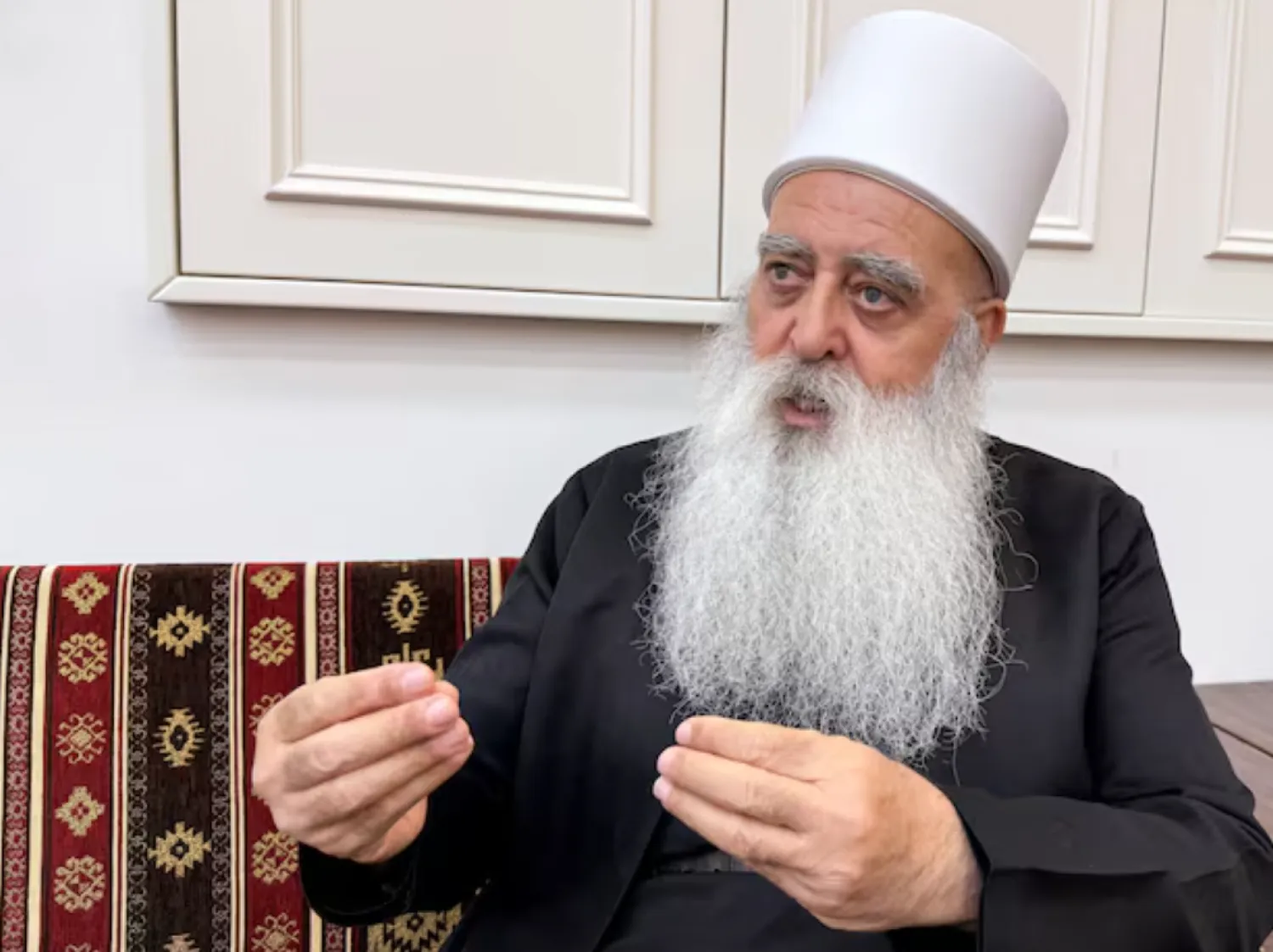 Leader of the Druze community in Israel, Sheikh Mowafaq Tarif, speaks with Reuters at his house in Julis, northern Israel July 28, 2025. REUTERS/Ali Sawafta 