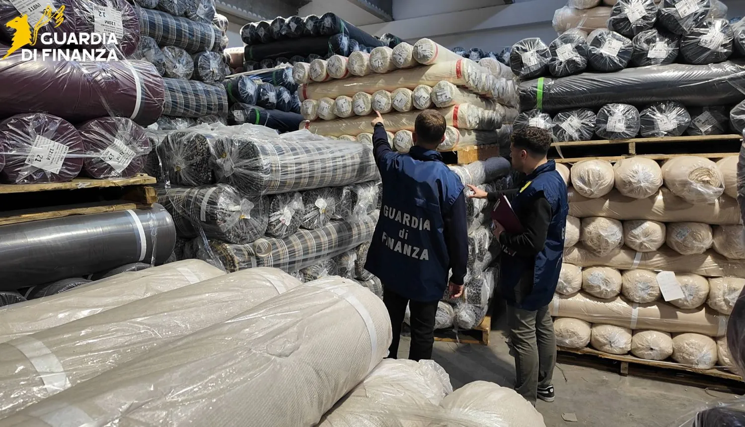 Italian Guardia di Finanza (Tax Police) carry out a search at a textile firm during an investigation, in the Tuscan city of Prato, Italy, in this handout photo obtained by Reuters. Guardia di Finanza Press Office/Handout via REUTERS