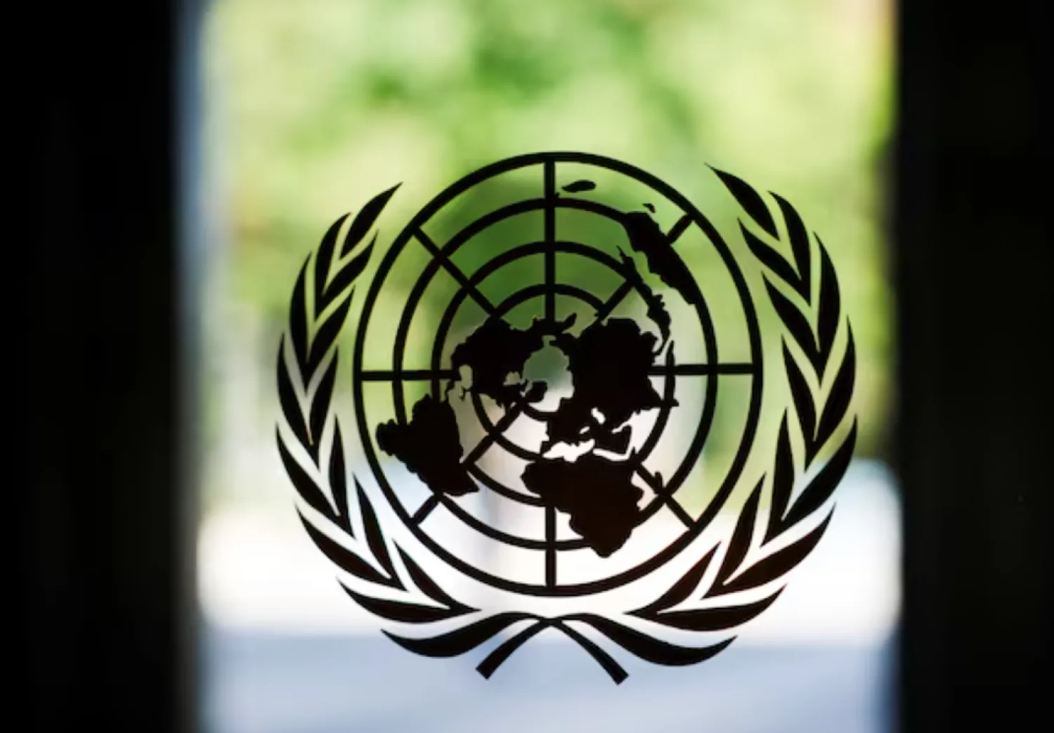 The United Nations logo adorns a window at UN headquarters in New York City, US, September 18, 2025. REUTERS/Jeenah Moon 