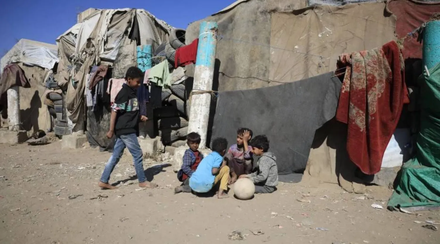 Displaced children gather in a camp in Sanaa. EPA
