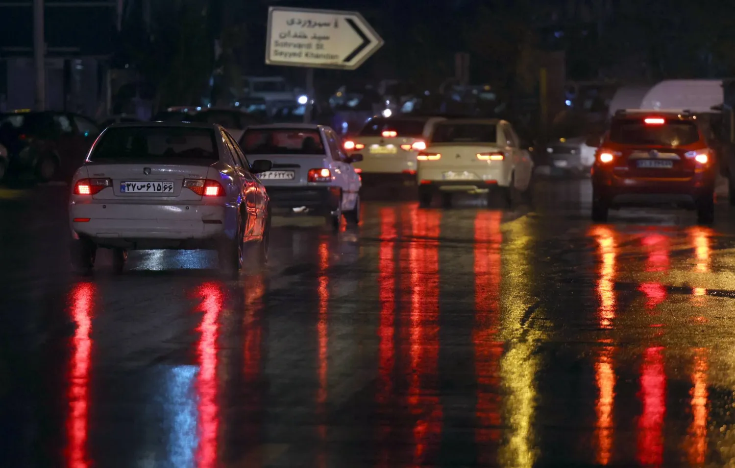 Iranians drive during a heavy rainfall in a street in Tehran, Iran, 11 December 2025. (EPA)