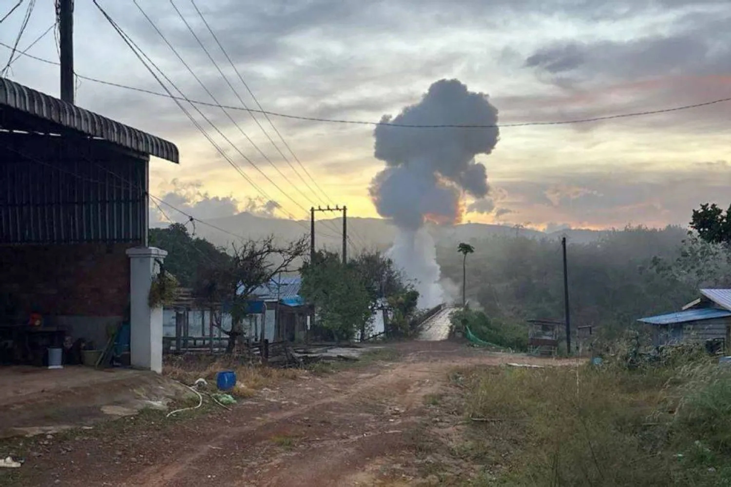 This handout photo taken and released by Agence Kampuchea Press (AKP) on December 13, 2025 shows smoke rising following a blast in Pursat province, amid clashes along the Cambodia-Thailand border. (Handout / Agence Kampuchea Press (AKP) / AFP)