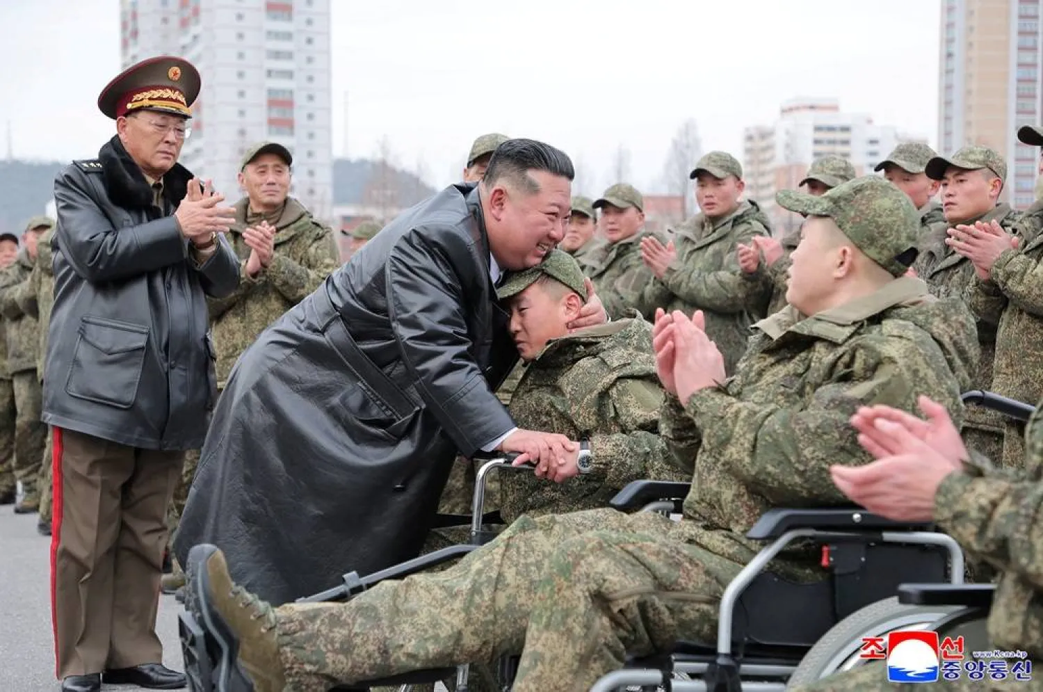 North Korean leader Kim Jong Un embraces a soldier during a welcoming ceremony for members of the 528th Engineer Regiment after they returned from an overseas mission, at the April 25 Cultural and Tourism Center in Pyongyang, North Korea, December 12, 2025, in this picture released by North Korea's official Korean Central News Agency on December 13, 2025. (KCNA via Reuters) 
