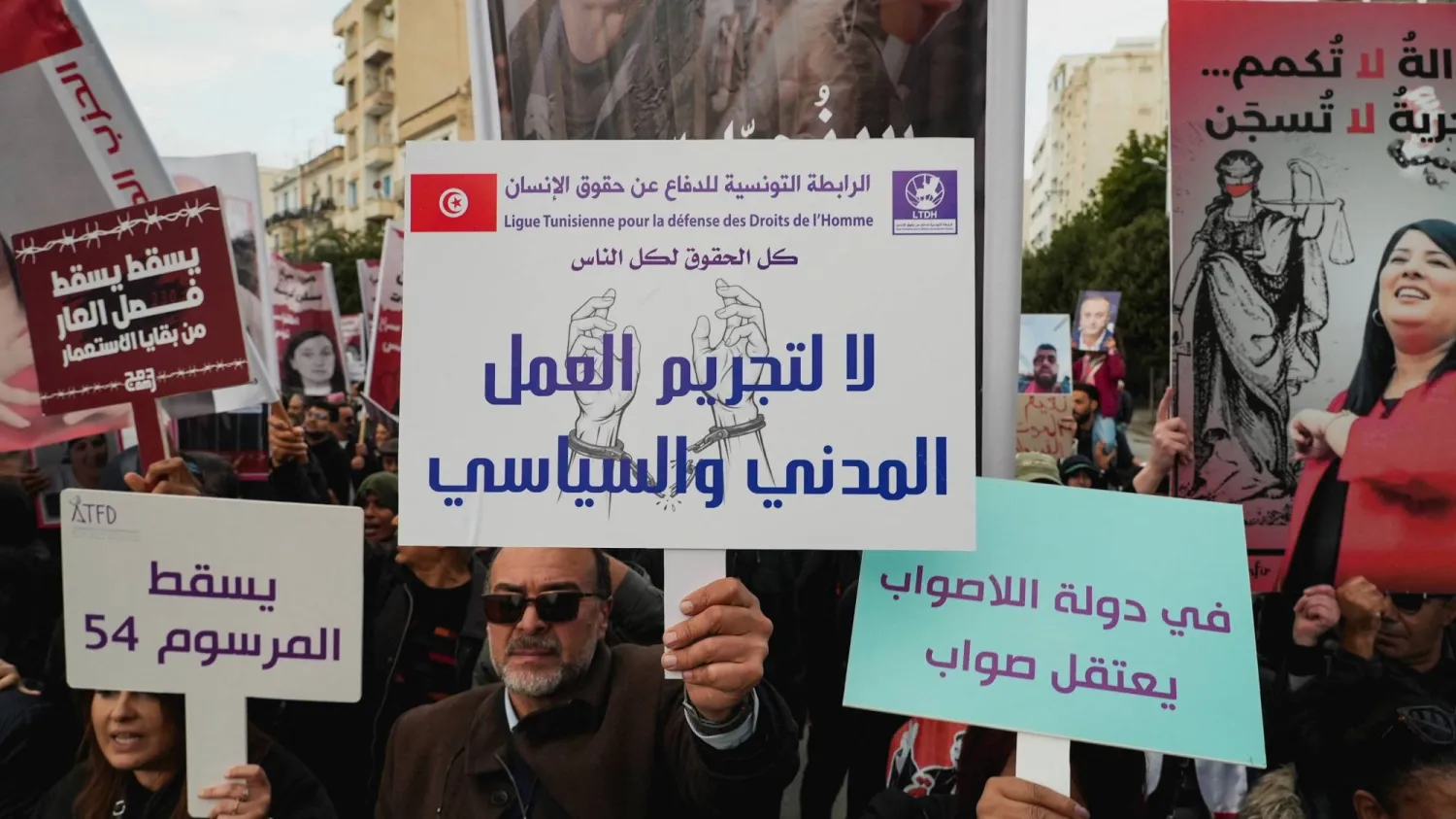 Activists and political opponents take part in a protest against Tunisian President Kais Saied, calling for an end to one-man rule and the restoration of democracy, in Tunis, Tunisia, December 13, 2025. REUTERS/Jihed Abidellaoui