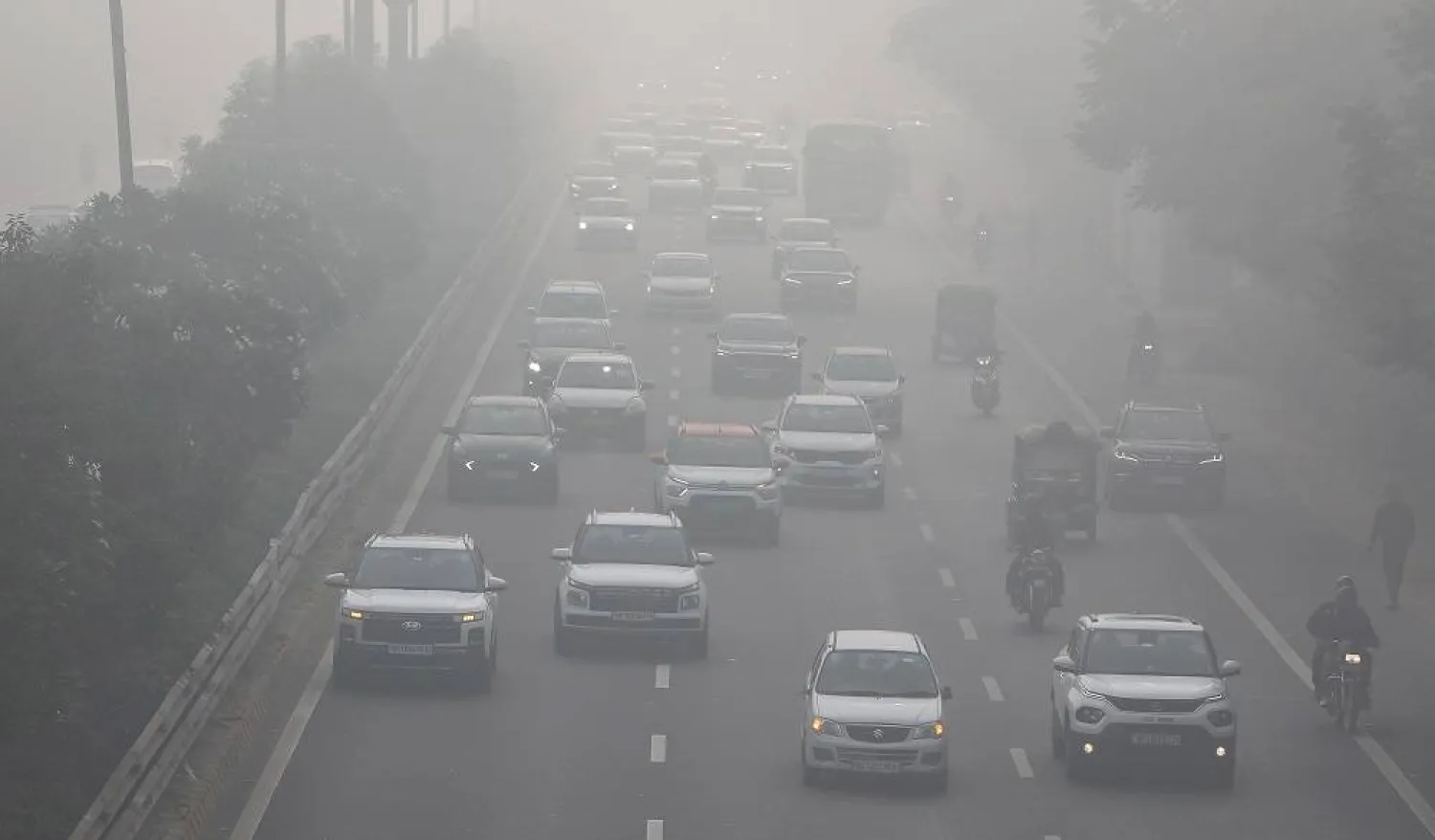 Vehicles move on a road amid heavy smog near New Delhi, India, 15 December 2025. (EPA)
