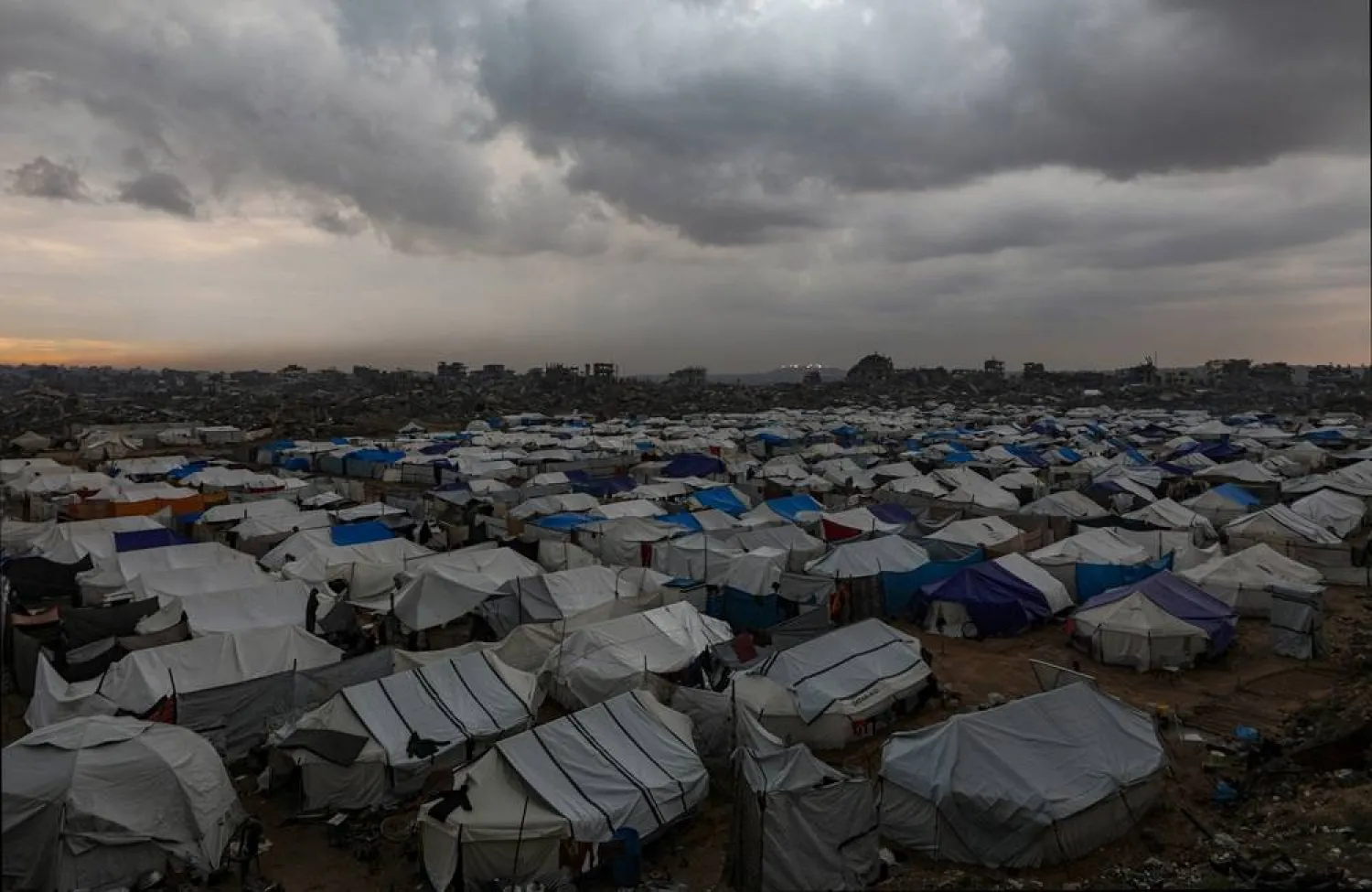 Tents of internally displaced Palestinian families seen among the ruins of destroyed buildings in Al-Zaitun neighborhood during a rainy day in the east of Gaza City on, 12 December 2025, amid a ceasefire between Israel and Hamas. (EPA)