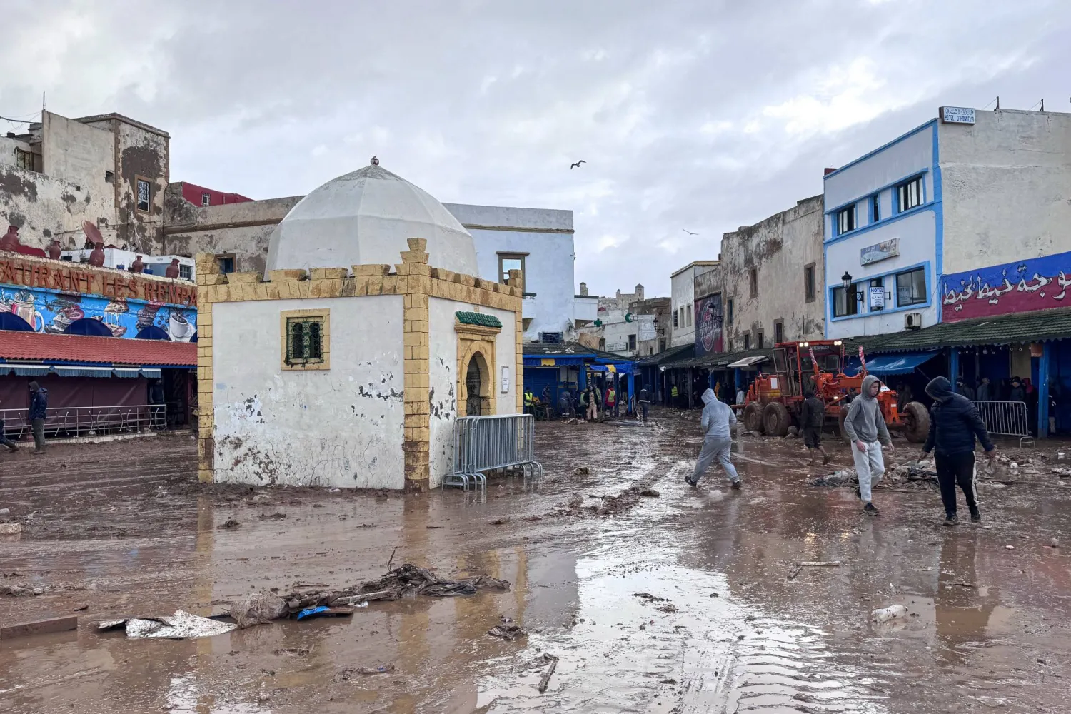 People inspect the damage caused by flash floods in Safi, Morocco, Monday, Dec. 15, 2025. (AP Photo/Abderrazak Gouach)