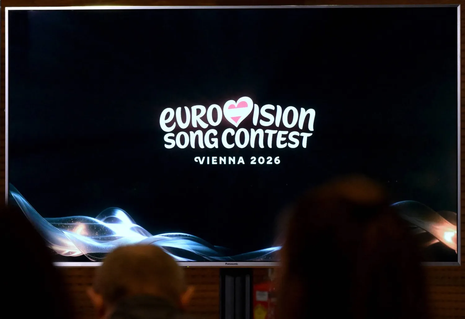 A screen shows the logo of the Eurovision Song Contest (ESC) 2026 during a press conference of Austrian national public broadcaster ORF in Vienna on December 16, 2025. (AFP)
