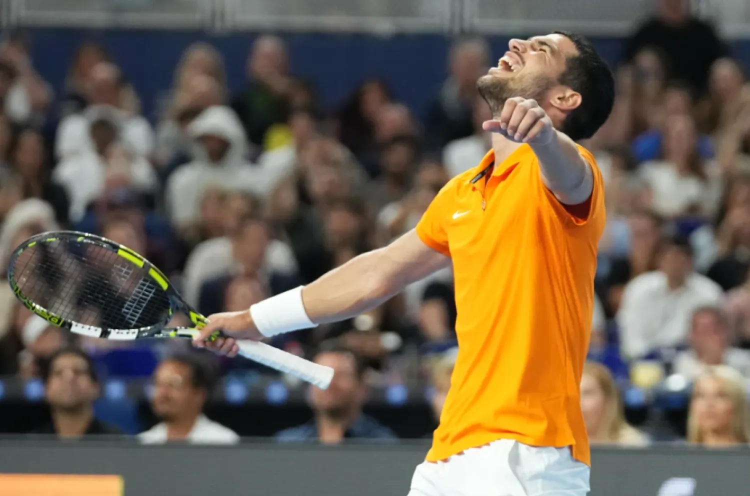 Carlos Alcaraz reacts after winning the first set against Joao Fonseca during the Miami Tennis Invitational tournament, Monday, Dec. 8, 2025, in Miami. (AP Photo/Lynne Sladky)

