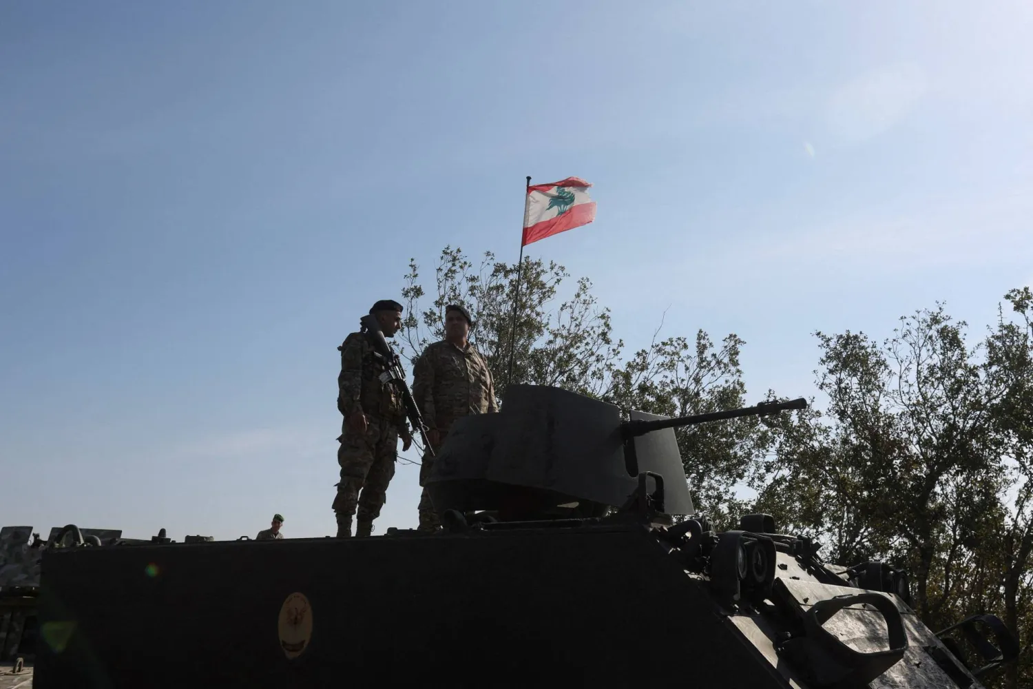 Lebanese army members stand on a military vehicle during a Lebanese army media tour, to review the army's operations in the southern Litani sector, in Alma Al-Shaab, near the border with Israel, southern Lebanon, November 28, 2025. (Reuters) 