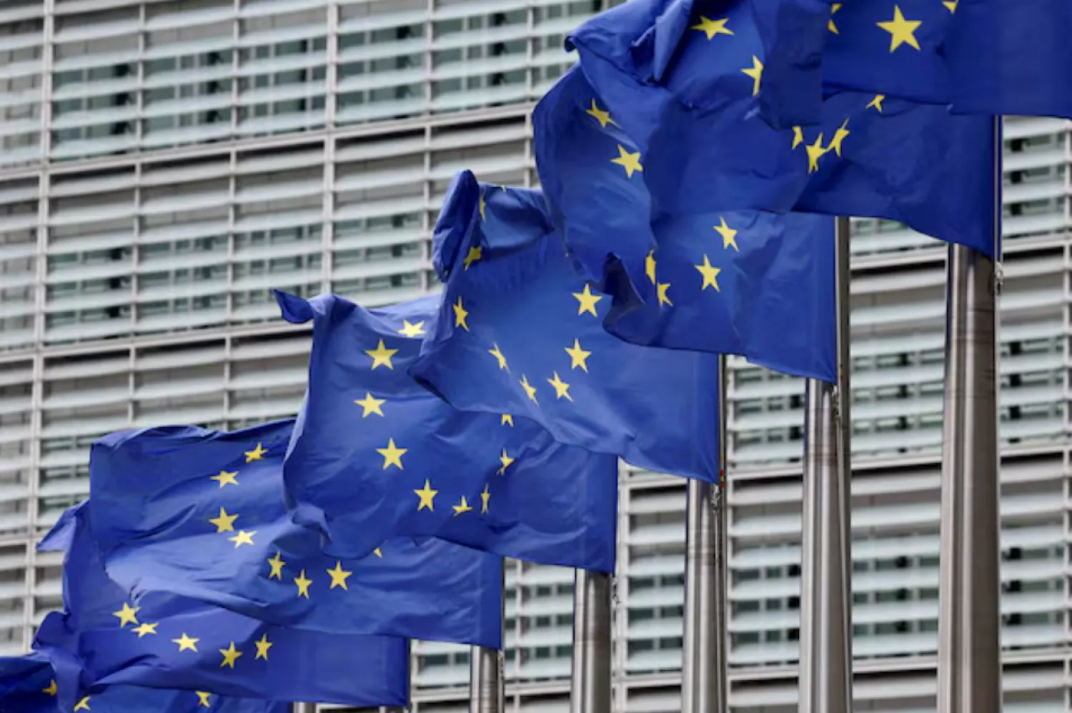 European Union flags flutter outside the EU Commission headquarters in Brussels, Belgium July 16, 2025. REUTERS/Yves Herman/File Photo 