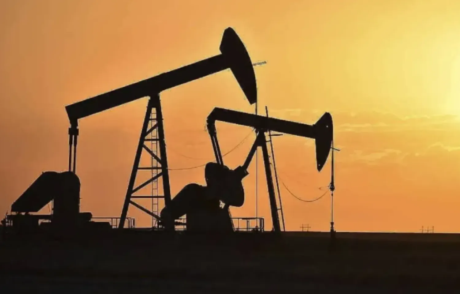 FILE - Pump jacks extract oil from beneath the ground in North Dakota, May 19, 2021. (AP Photo/Matthew Brown, File)
