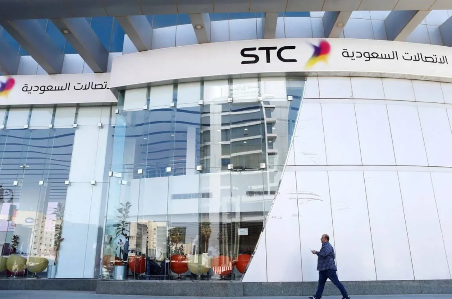 A man passes the Saudi Telecom STC office in Riyadh, Saudi Arabia, February 6, 2018. (Reuters)
