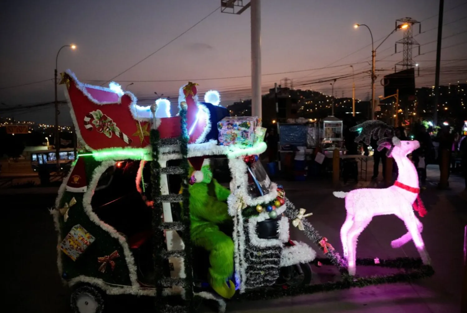 A Peruvian moto-taxi, adorned with festive Christmas decorations to resemble a sleigh, drives through the streets of Lima, spreading seasonal joy as the holiday celebrations draw near, in Lima, Peru, December 12, 2025. REUTERS/Angela Ponce 