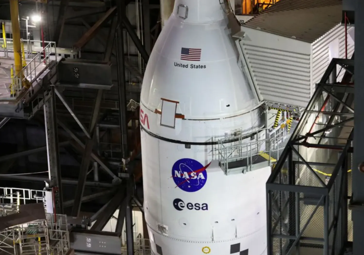 NASA's next-generation moon rocket, the Space Launch System (SLS) rocket with its Orion crew capsule perched on top, is seen in the Vehicle Assembly Building (VAB) before it is scheduled to make a slow-motion journey to its launch pad at Cape Canaveral, Florida, US March 16, 2022. REUTERS/Thom Baur