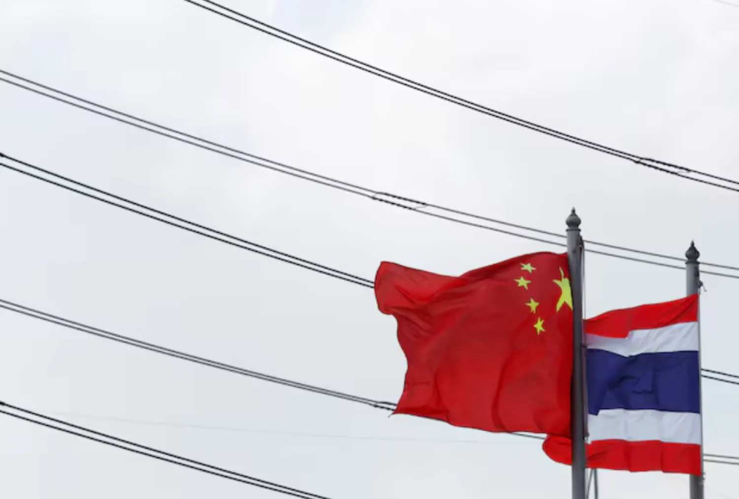Flags flutter at an entrance of Thai-Chinese Rayong Industrial Zone in Rayong province, east of Bangkok, Thailand, April 7, 2016. REUTERS/Chaiwat Subprasom 