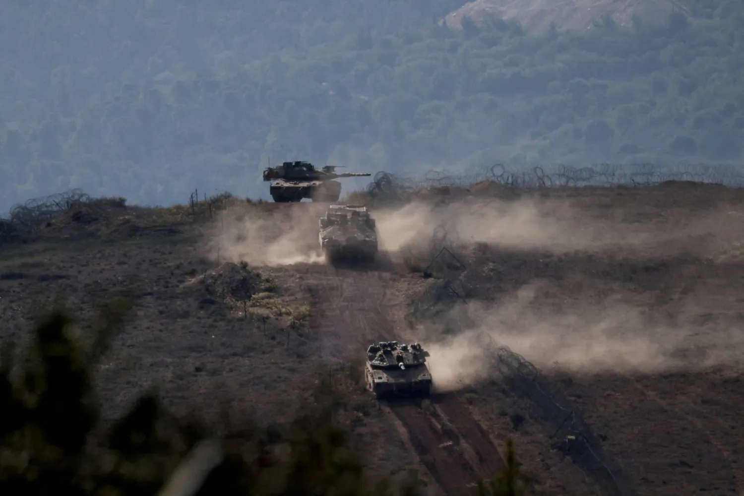 FILE PHOTO: Lebanese army members stand on a military vehicle during a Lebanese army media tour, to review the army's operations in the southern Litani sector, in Alma Al-Shaab, near the border with Israel, southern Lebanon, November 28, 2025. REUTERS/Aziz Taher/File Photo