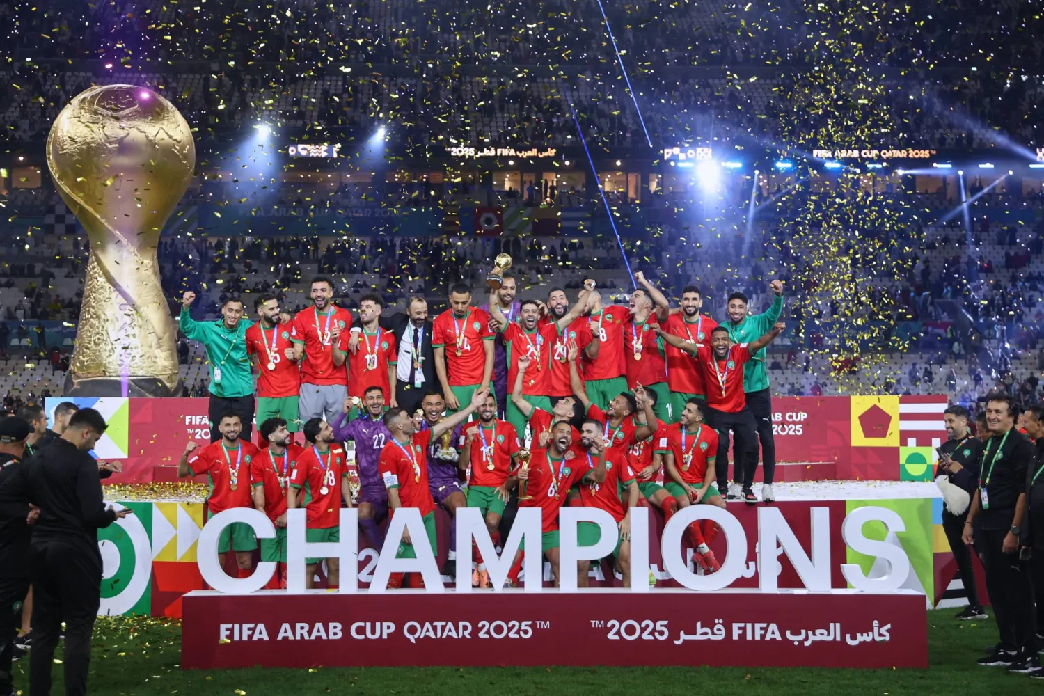 Morocco's players celebrate with the winner trophy after defeating Jordan in the FIFA Arab Cup final soccer match in Lusail, Qatar, Thursday, Dec. 18, 2025. (AP Photo/Hussein Sayed)
