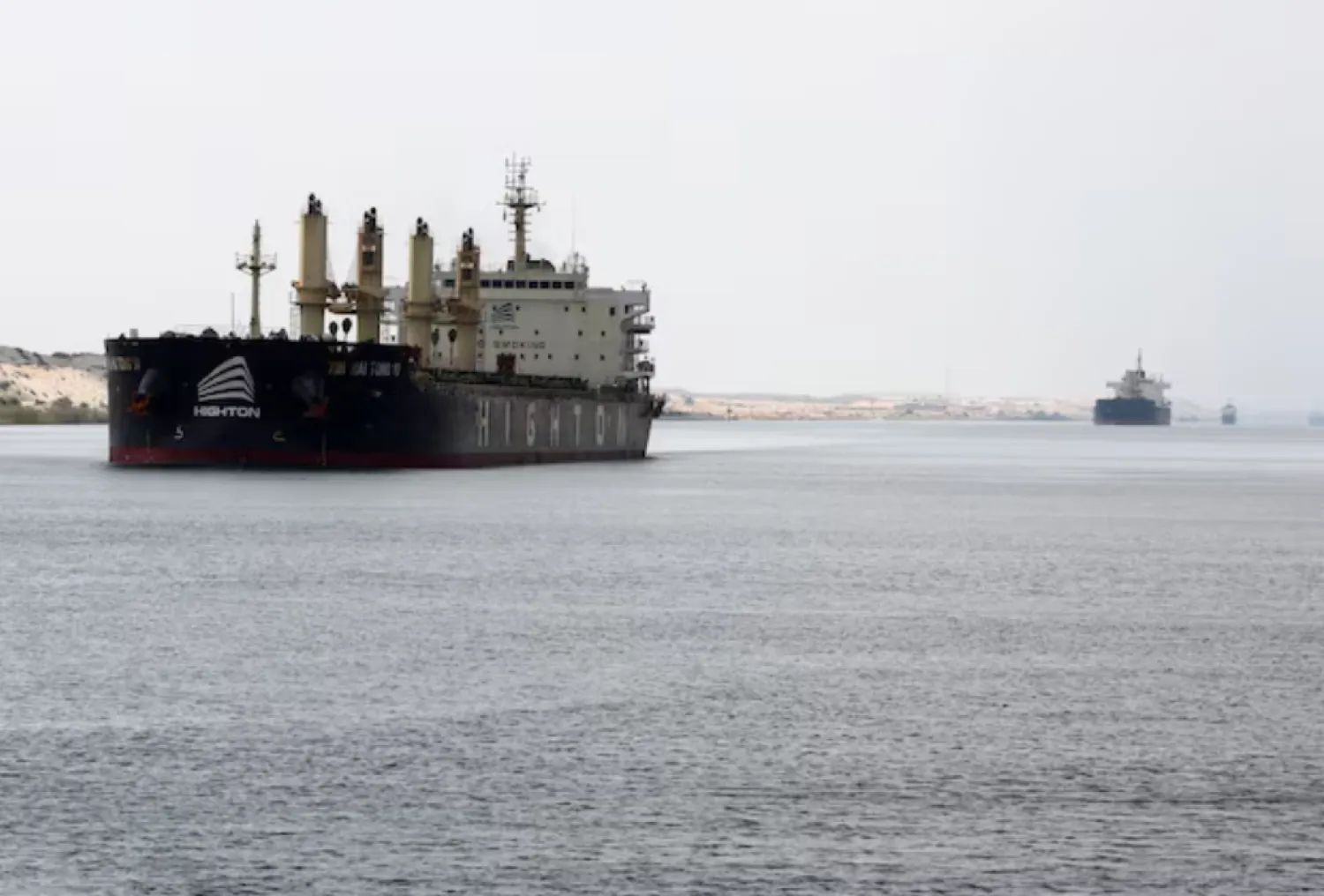 Ships move through the Suez Canal, in Ismalia, Egypt, July 31, 2025. REUTERS/Mohamed Abd El Ghany/File Photo 