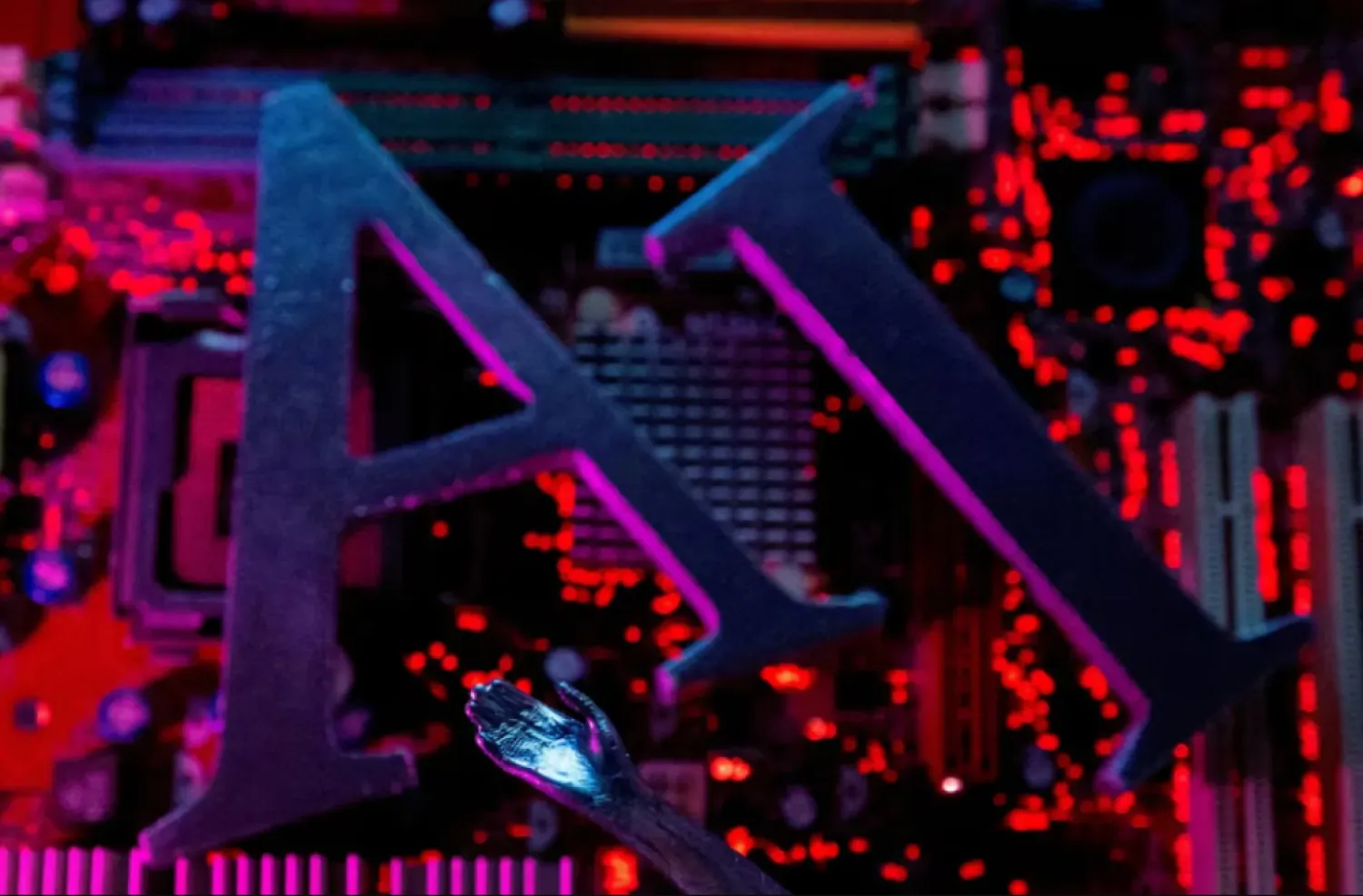 AI (Artificial Intelligence) letters and robot hand are placed on computer motherboard in this illustration created on June 23, 2023. REUTERS/Dado Ruvic/Illustration/File Photo
