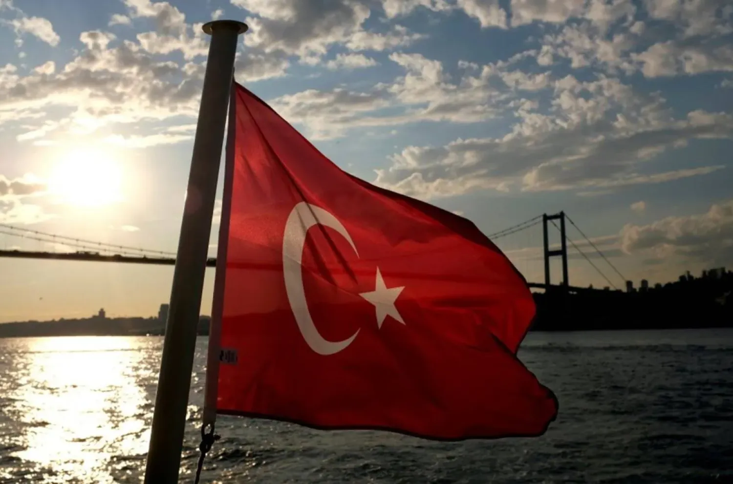 A Turkish flag with the Bosphorus Bridge in the background, flies on a passenger ferry in Istanbul, Türkiye September 30, 2020. (Reuters)
