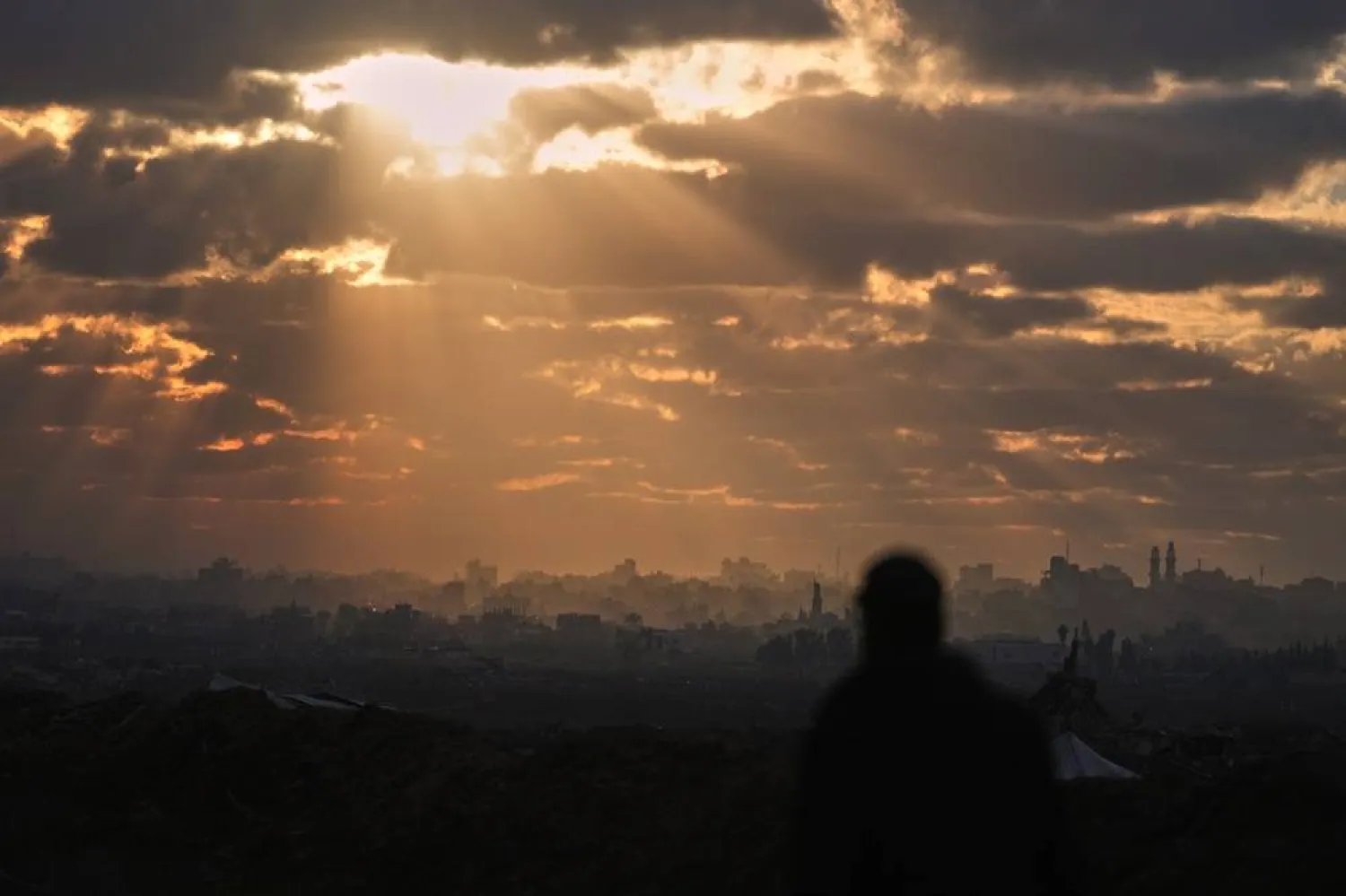  A Palestinian looks over an area of buildings destroyed during Israeli air and ground operations at sunset in northern Nuseirat, central Gaza Strip, Friday, Dec. 19, 2025. (AP) 