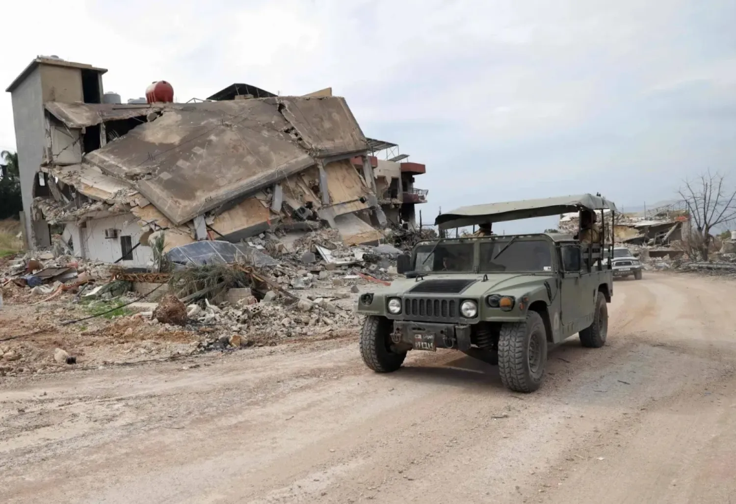 A Lebanese Army vehicle near a destroyed position in the town of Naqoura in South Lebanon (AFP)

