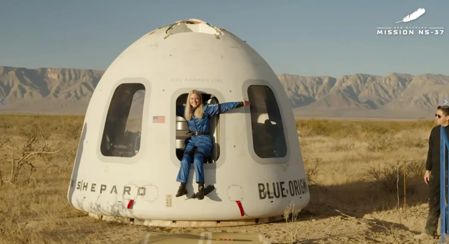 This image provided by Blue Origin, Michaela Benthaus poses after the Blue Origin's capsule landed on Saturday, Dec. 20, 2025 in West Texas. (Blue Origin via AP)
