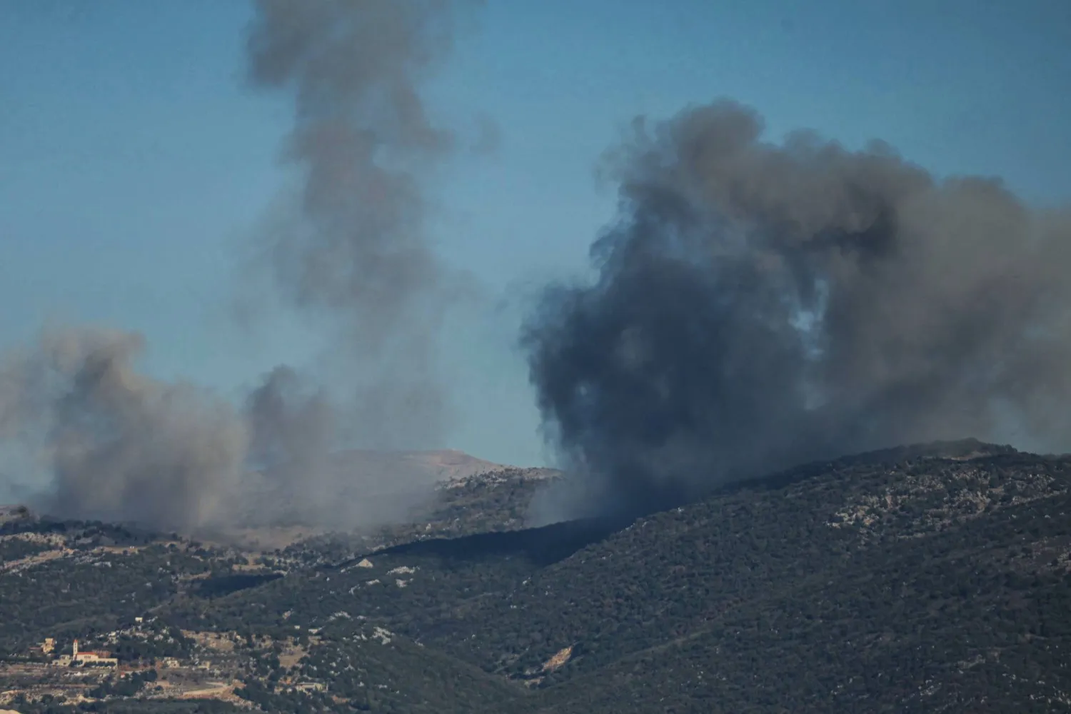 Smoke rises from the site of a series of Israeli airstrikes that targeted the outskirts of the southern Lebanese village of al-Katrani on December 18, 2025. (AFP)