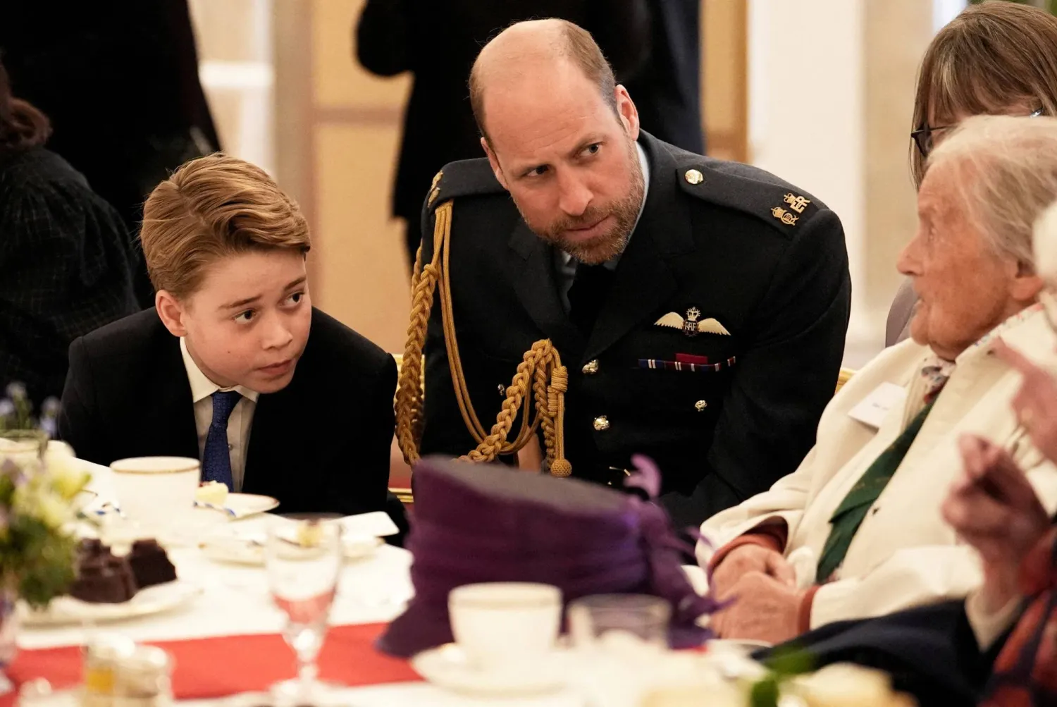 Britain's Prince William, Prince of Wales and Prince George join Second World War veterans at a tea party in Buckingham Palace, central London, following the military procession to mark the 80th anniversary of VE Day, May 5, 2025. (Reuters)