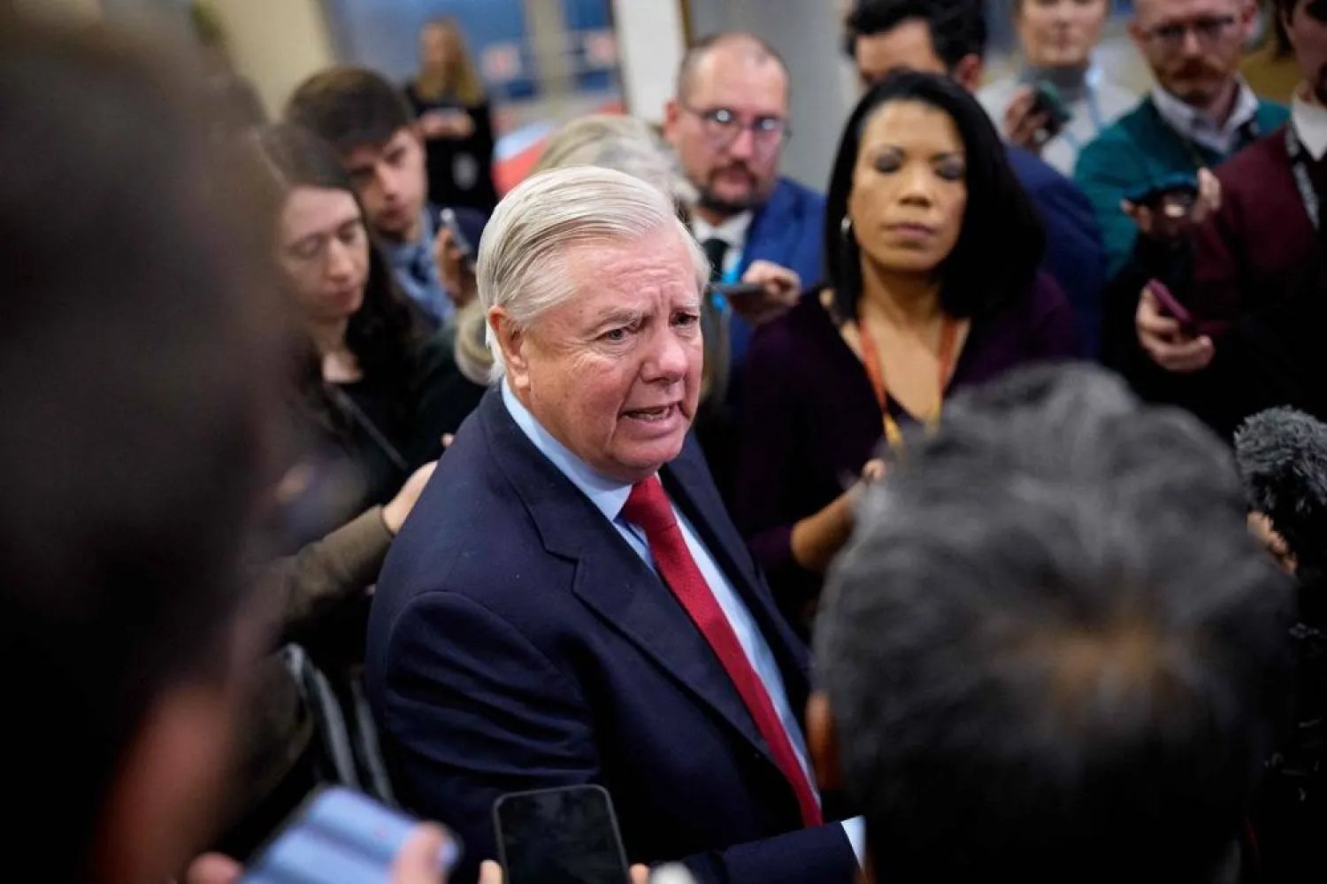 Sen. Lindsey Graham (R-SC) speaks to reporters after Secretary of War Pete Hegseth and Secretary of State Marco Rubio attend closed door meetings with lawmakers on Capitol Hill on December 16, 2025 in Washington, DC. (Getty Images via AFP) 
