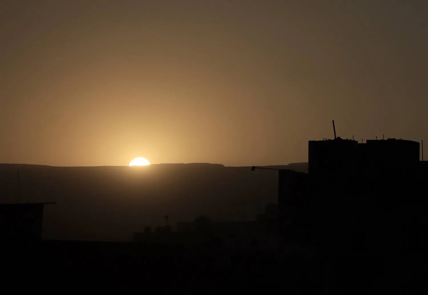 The sun sets over a residential neighborhood of Sanaa, Yemen, 20 December 2025. EPA/YAHYA ARHAB