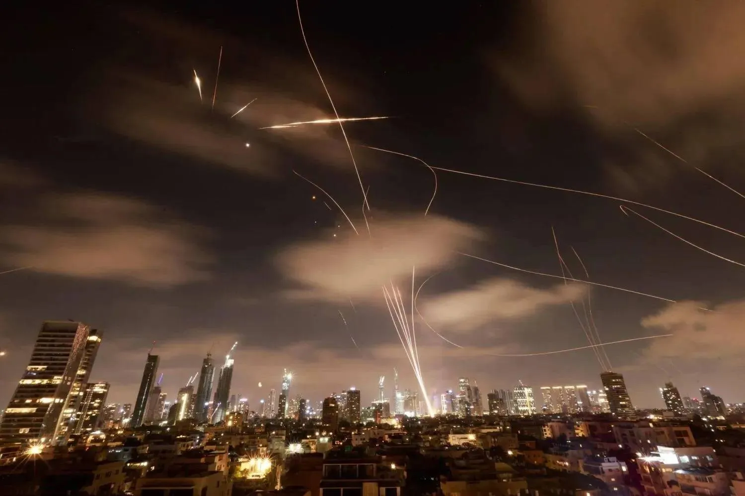 Israeli defenses intercept Iranian missiles over Tel Aviv on June 22. (AFP) 