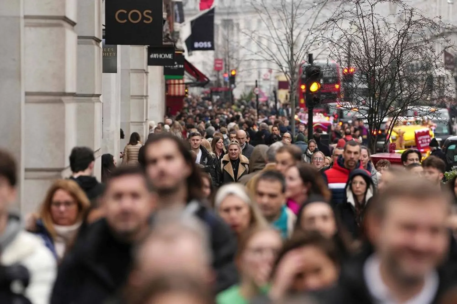 Shoppers fill the pavement on Regent Street in central London on December 21, 2025. (AFP)