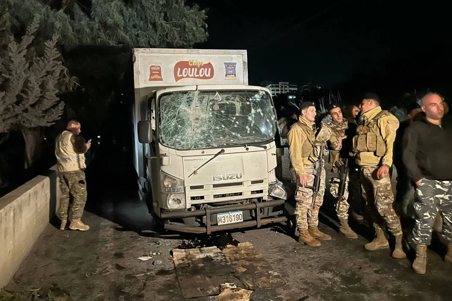 Lebanese soldiers secure the site of an Israeli drone strike that targeted a truck in the village of Sibline, south of Beirut, on December 16, 2025. (Photo by Mahmoud ZAYYAT / AFP)