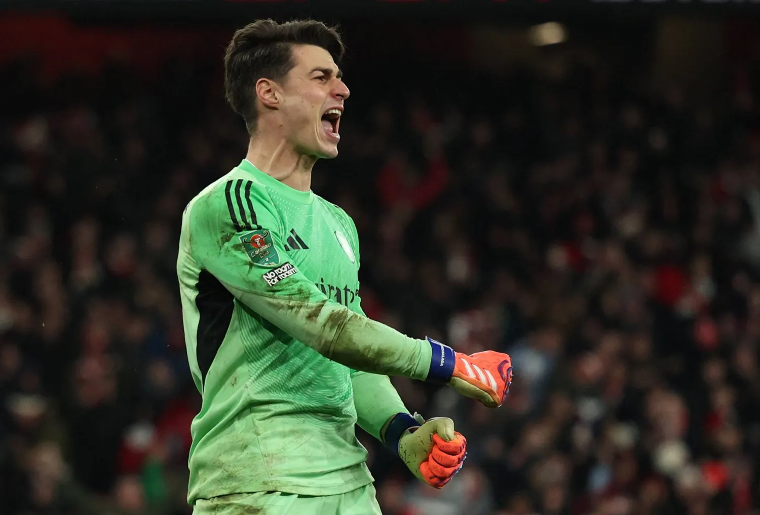 Arsenal's Spanish goalkeeper #13 Kepa Arrizabalaga celebrates saving the penalty of Crystal Palace's French defender #05 Maxence Lacroix to win the English League Cup quarter-final football match between Arsenal and Crystal Palace at the Emirates Stadium, in London on December 23, 2025. (AFP)