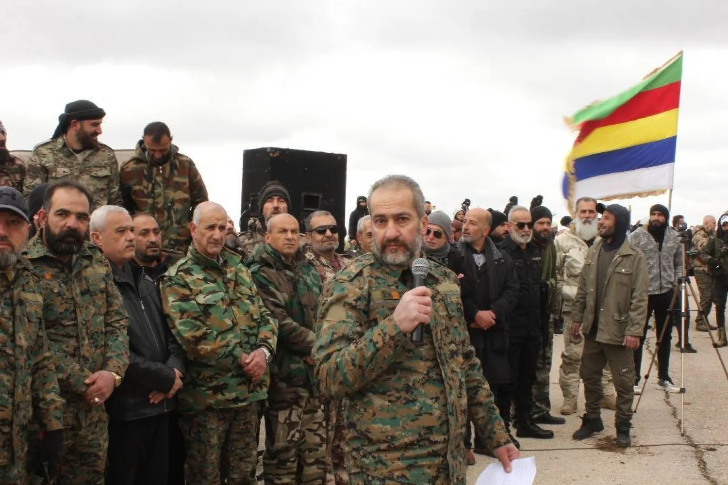 Head of the Military Council, Tareq al-Shoufi, is seen with his fighters.
