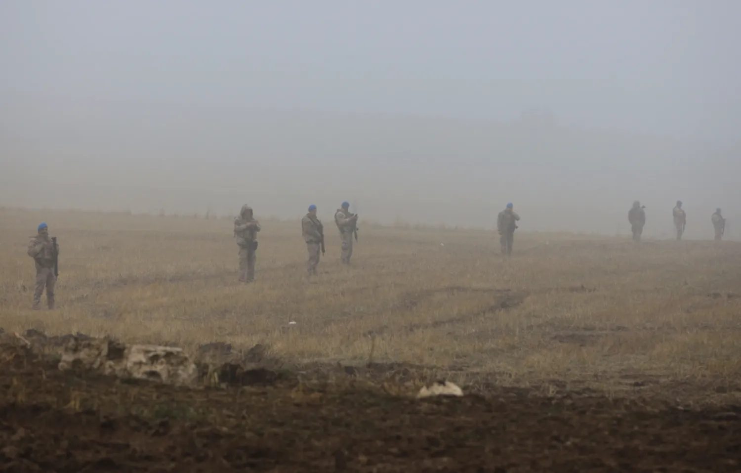 Turkish army soldiers stand guard as rescue teams search for the remains of a private jet carrying Libya's military chief and four others that crashed after taking off from Ankara, killing everyone on board, in Ankara, Turkey, early Wednesday, Dec. 24, 2025. (AP Photo/Efekan Akyuz)