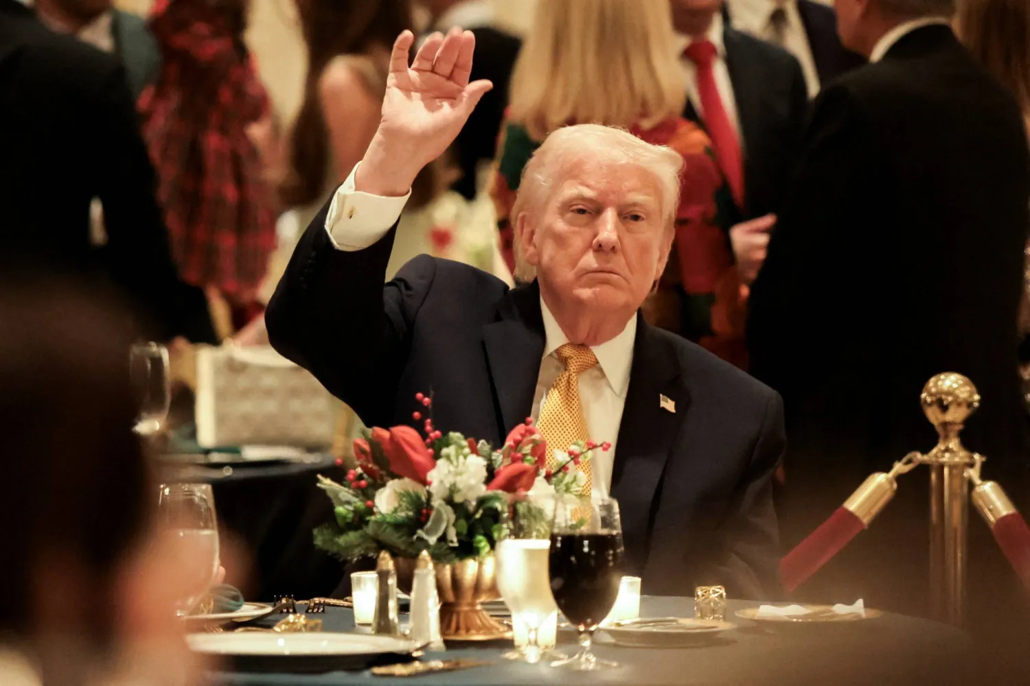 US President Donald Trump takes part in a Christmas Eve dinner in the ballroom of his Mar-a-Lago club in Palm Beach, Florida, US, December 24, 2025. REUTERS/Jessica Koscielniak