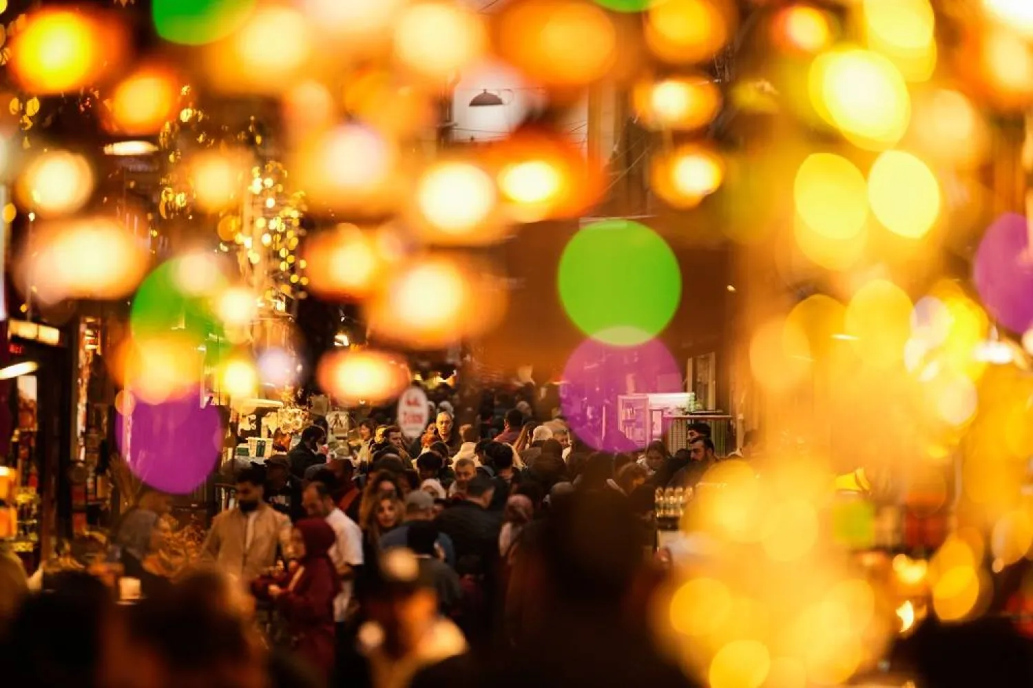  People shop at the historic Eminonu Bazaar decorated with Christmas lights in Istanbul, Wednesday, Dec. 24, 2025. (AP) 