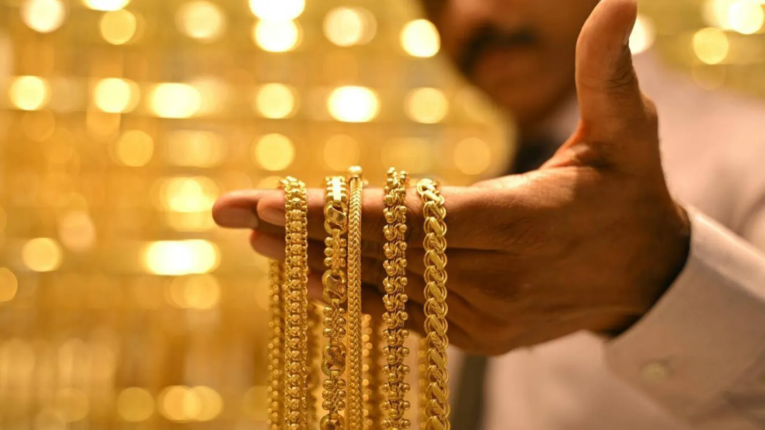 A salesman displays gold chains at an Indian jewelry store in September. Idrees MOHAMMED / AFP
