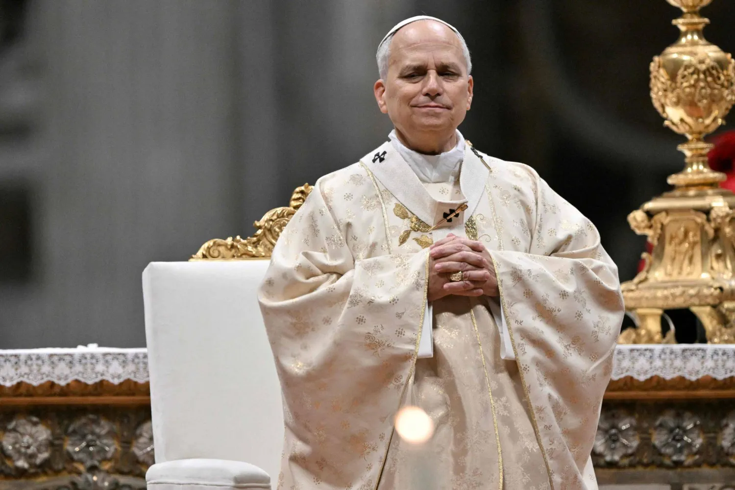  Pope Leo XIV arrives looks on as he performs the Christmas mass at St Peter's Basilica in the Vatican on December 25, 2025. (AFP) 