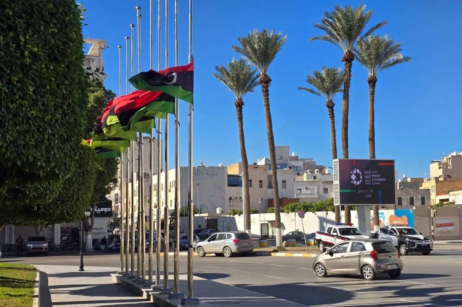 Libyan national flags fly at half-mast in Tripoli on December 24, 2025, after the head of Libya's armed forces and his four aides died in a plane crash in Türkiye. (AFP)