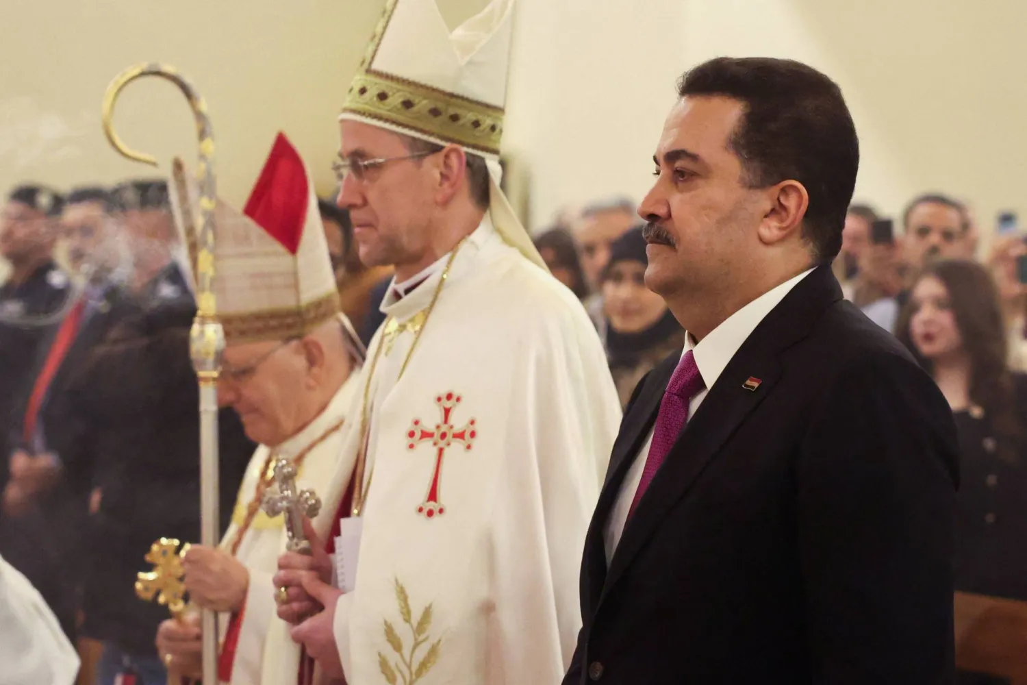 السوداني قال خلال قداس الميلاد إن التطبيع أمر مرفوض في العراق (رويترز)