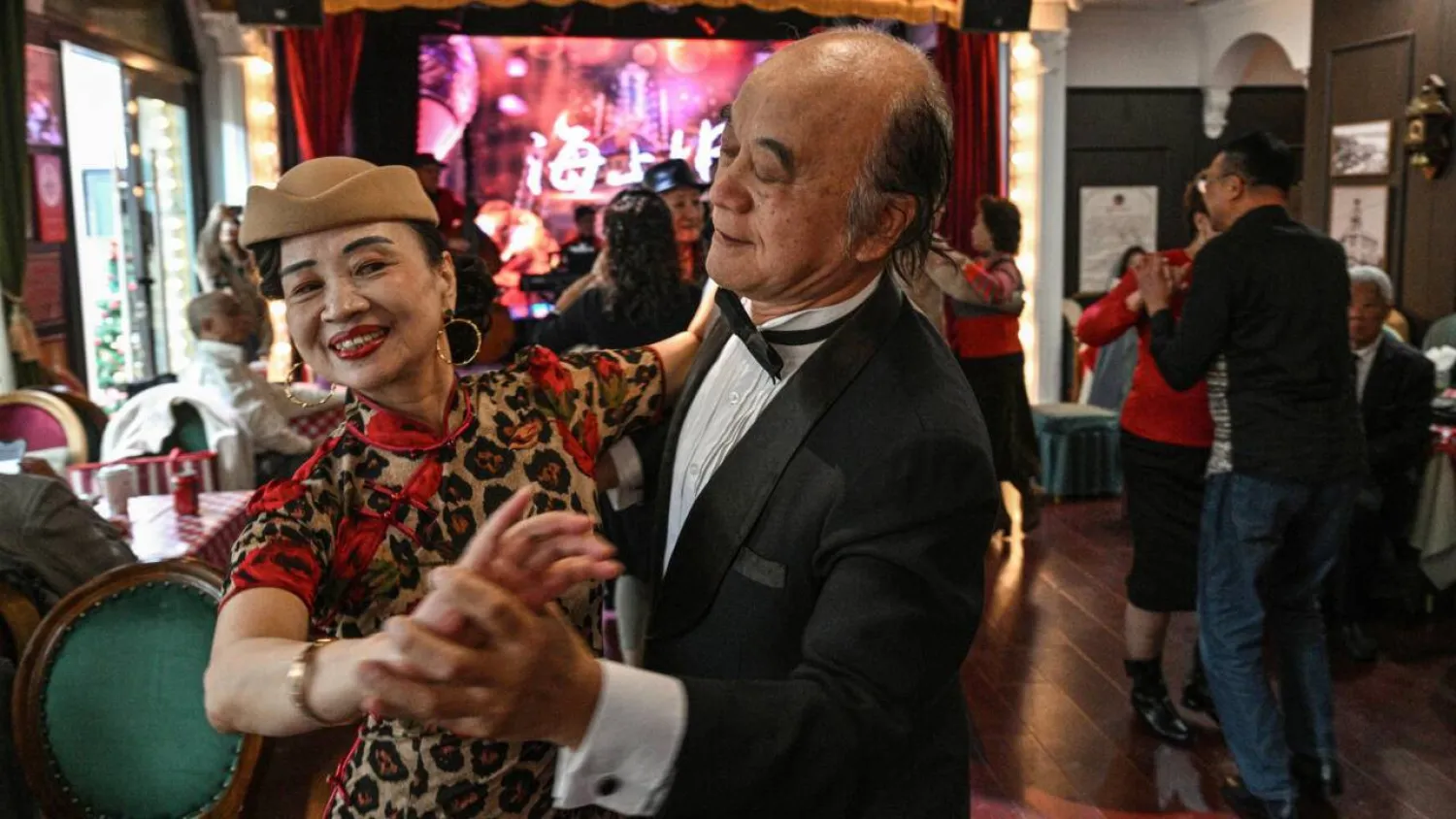 On any given day, multiple venues in Shanghai host hours-long dance sessions, a phenomenon born of the city's deeply of ballroom culture. Hector RETAMAL / AFP
