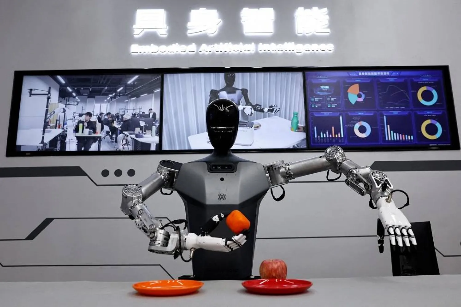 A humanoid robot Tiangong by Beijing Innovation Center of Humanoid Robotics Co, moves an orange as a demonstration at its company, during an organized media tour to Beijing Robotics Industrial Park, in Beijing Economic-Technological Development Area, also known as Beijing E-Town, China May 16, 2025. (Reuters)